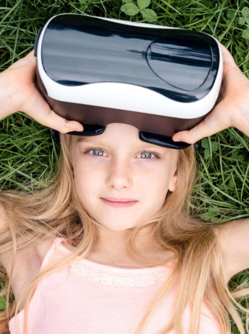 Girl in nature with VR-Headset
